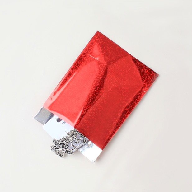 Red holographic postal mailing bag