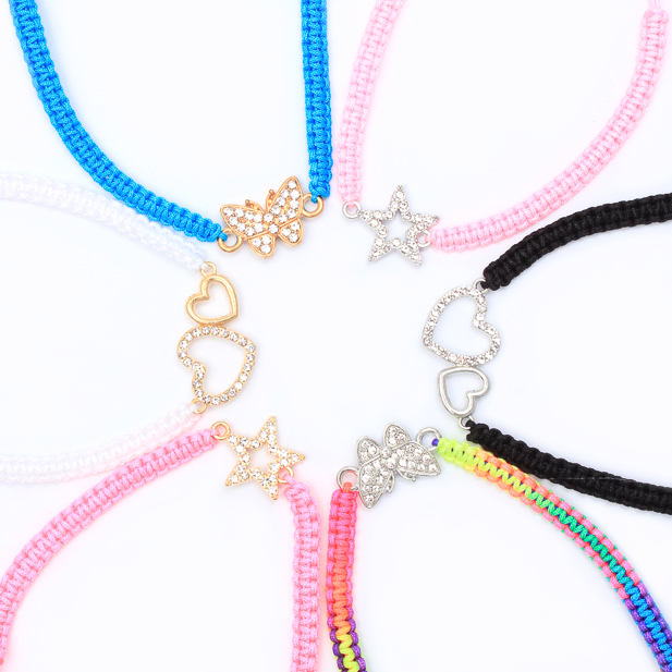 Corded charm bracelets with different charms.
