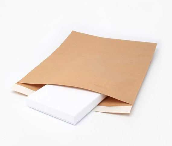 White earring box in brown postal envelope