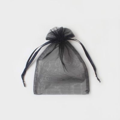 22x15cm. Black organza bag.