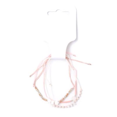 Card of 3 neutral corded bracelets with charms and beads