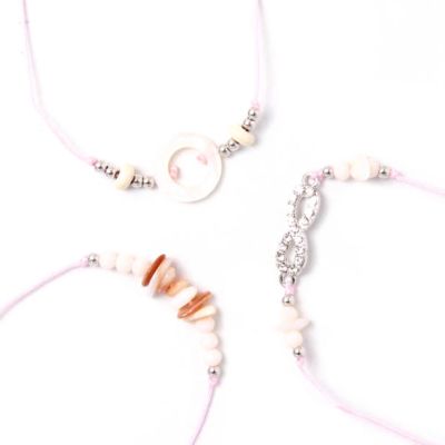 Card of 3 pink corded bracelets with stone chip charms