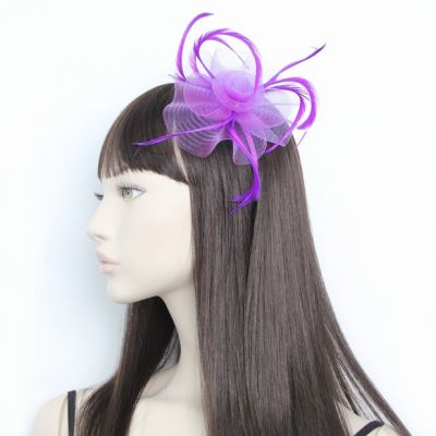 © Style Josie. Looped net and feather fascinator on an aliceband