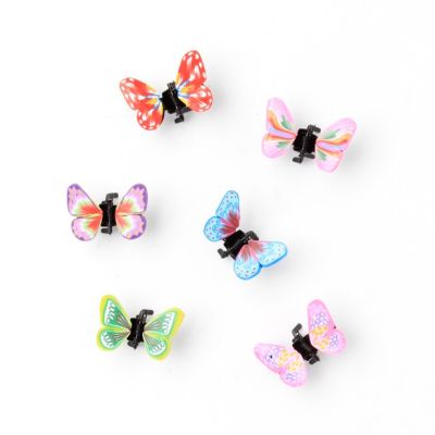 Card of 4 fimo style butterfly mini clamps. 1cm