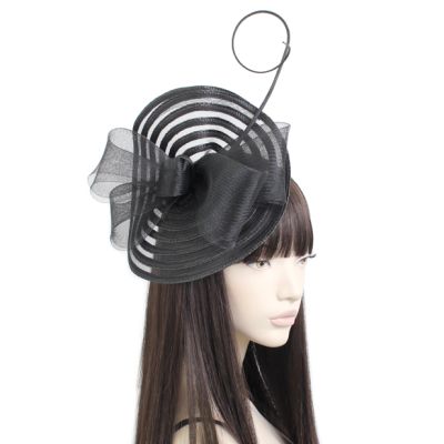 Style Iris. Black swirl net fascinator with decorative quill