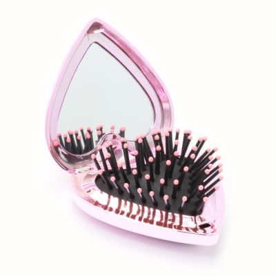 Folding heart shaped detangling brush