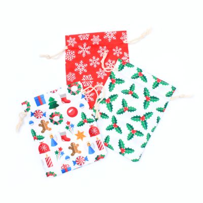 13x10cm. Mixed pack of Christmas drawstring pouches