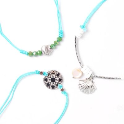 Card of 3 turquoise corded bracelets with beads and charms