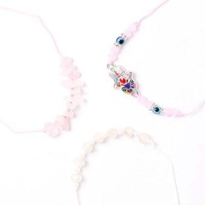 Card of 3 pink corded bracelets with charms and beads