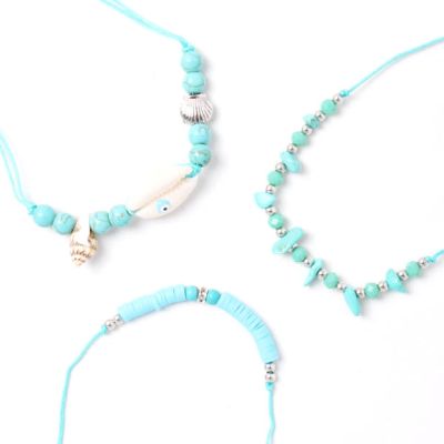 Card of 3 turquoise corded bracelets with beads and charms