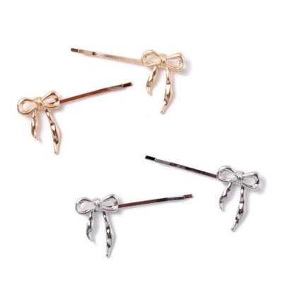 Card of 2 bow hair grips 5.5cm
