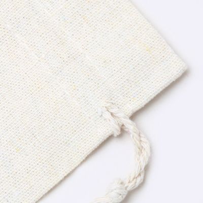Size: 16 x 14 cm. unbleached, raw cotton drawstring bag.
