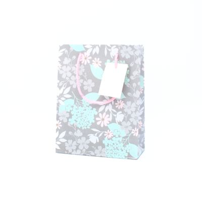 23x18x8cm. Grey floral print gift bag with tag