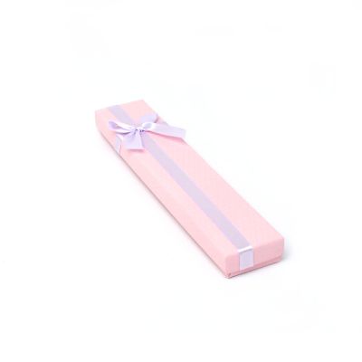 Bracelet / Pen box. 21x4x1.8cm. Pink box with lilac bow.