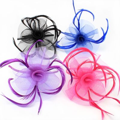 © Style Josie. Looped net and feather fascinator on an aliceband