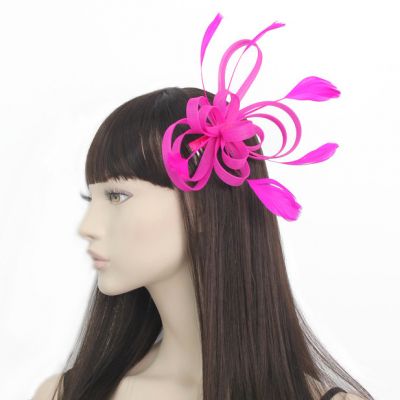 © Style Maisy. Fushcia looped fascinator on a side comb