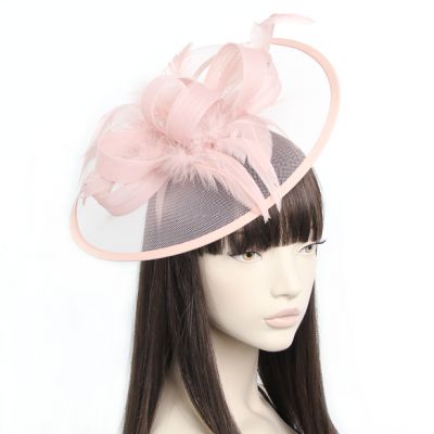 Style Doris. Dusky Pink net and feather fascinator on an aliceband