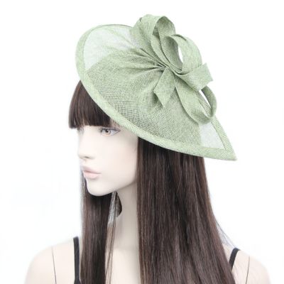 Style Lily. Green pointed sinamay fascinator with loops