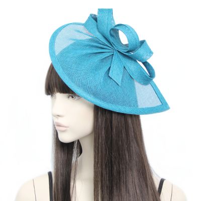 Style Lily. Teal pointed sinamay fascinator with loops