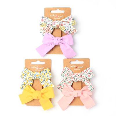 Card of 2 bow clips in 100% cotton. 5cm