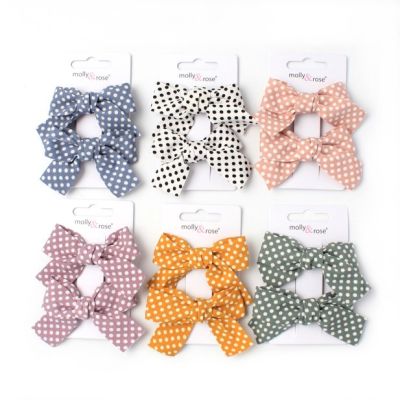 Polka dot fabric bows on a clip. 5cm