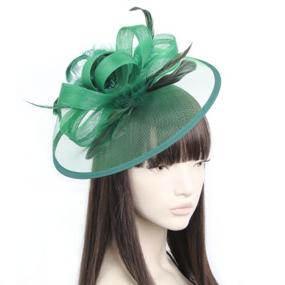 Style Doris. Green net and feather fascinator on an aliceband