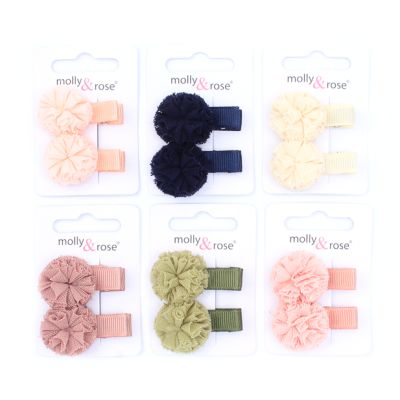 Net pom pom on a ribbon covered clip. 3.5cm