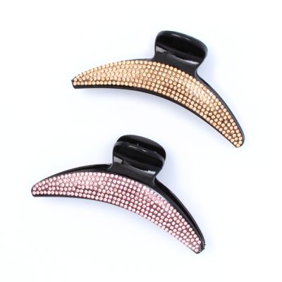 Curved plastic clamp with coloured diamantes. 11cm
