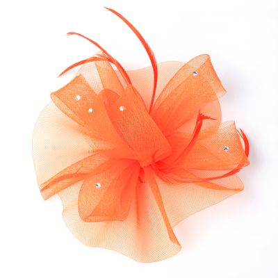 Style Luna. Orange net fascinator on a clip