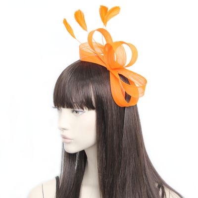 Style Ivy. Orange looped fascinator on an aliceband