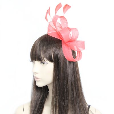 Style Ivy. Coral looped fascinator on an aliceband