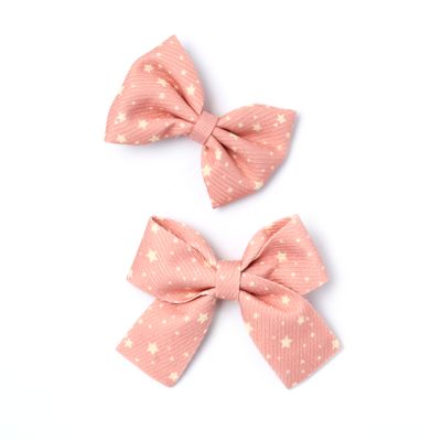 Card of 2 Star print bow beak clips 5cm