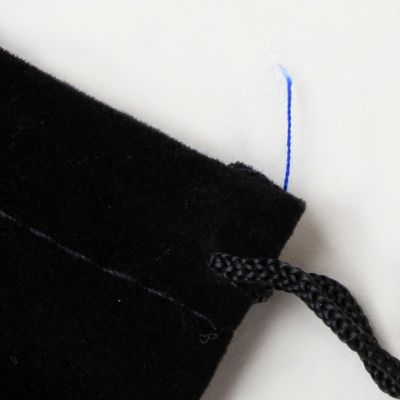 FAULTY Black velvet pouch 9x7cm. Blue threads