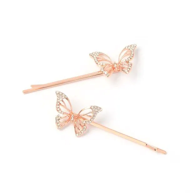 Card of 2 butterfly motif grips. 5.5cm