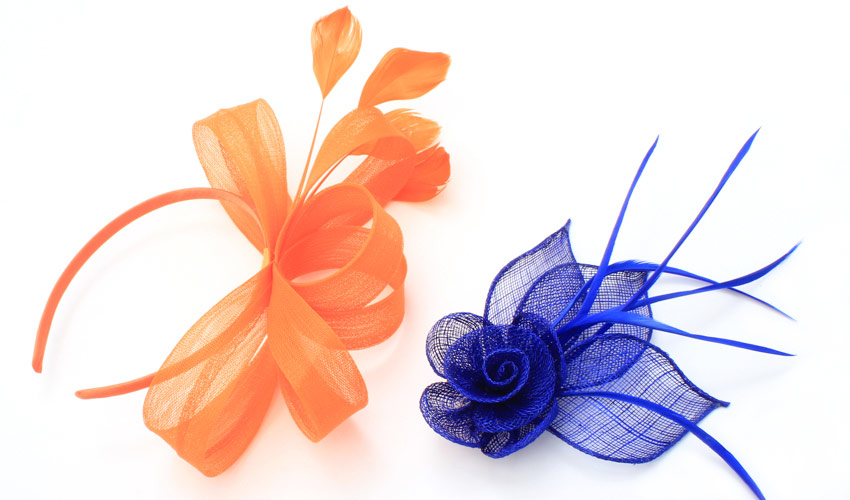 Orange fascinator on a headband and blue fascinator with comb 