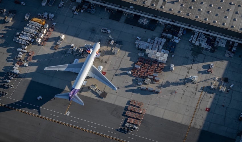 FedEx plane being loaded with cargo for international delivery